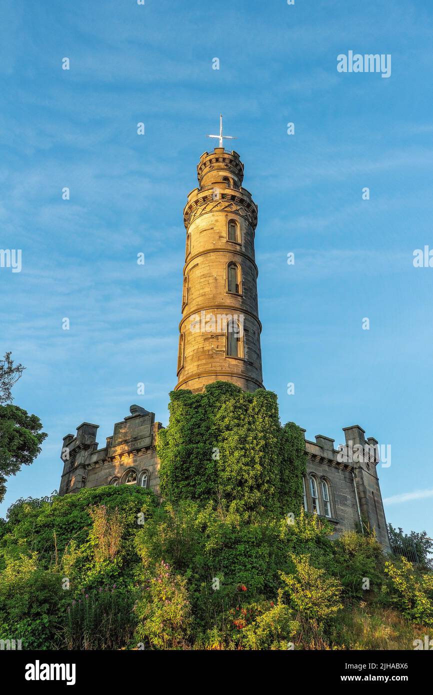 Nelsons Monument has a ball on top of the building when dropped at precisely 'one' clock is when the one 'o' clock gun is fired at Edinburgh Castle Stock Photo