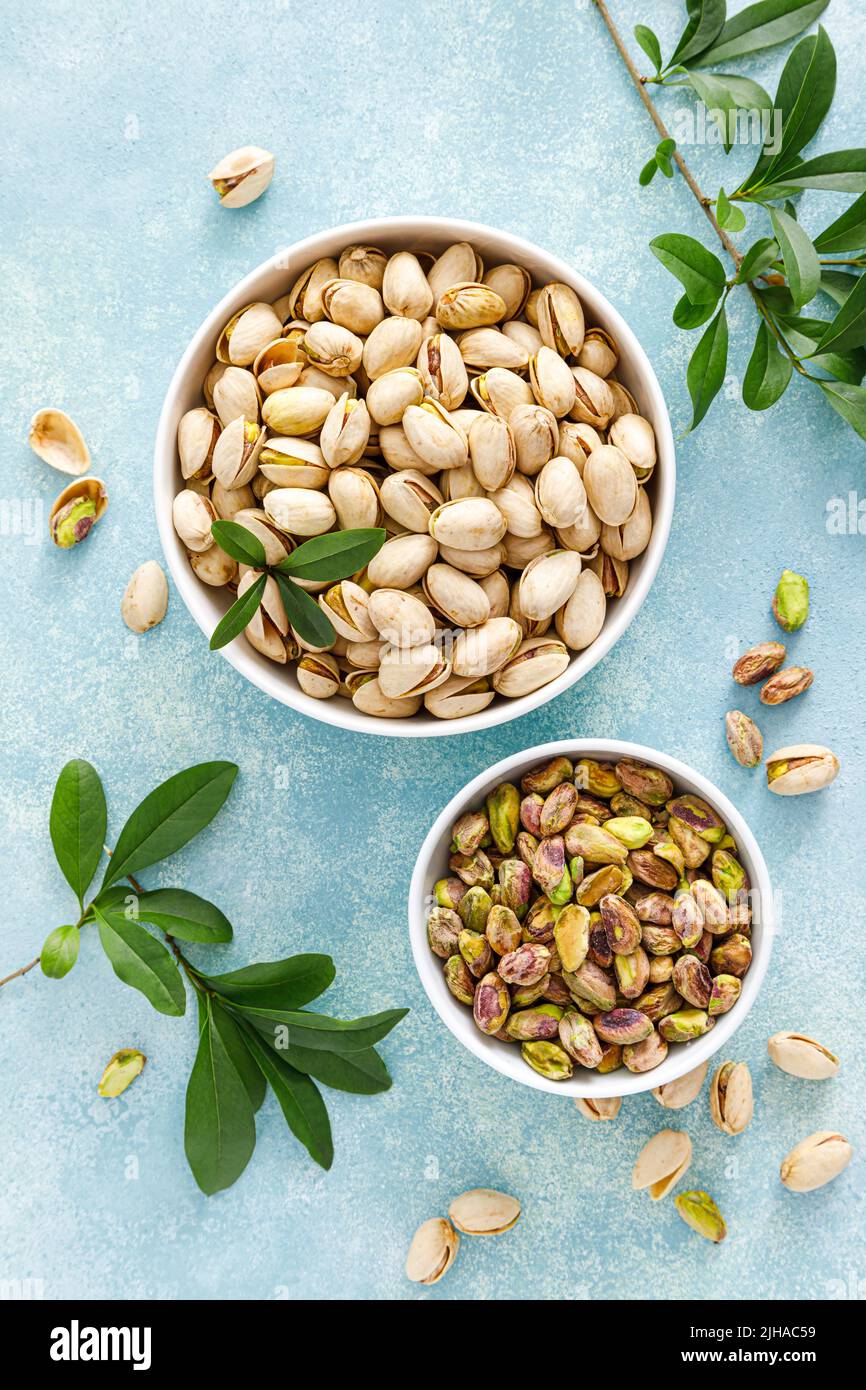 Pistachios. Whole pistachios with green leaves and pistachio nut