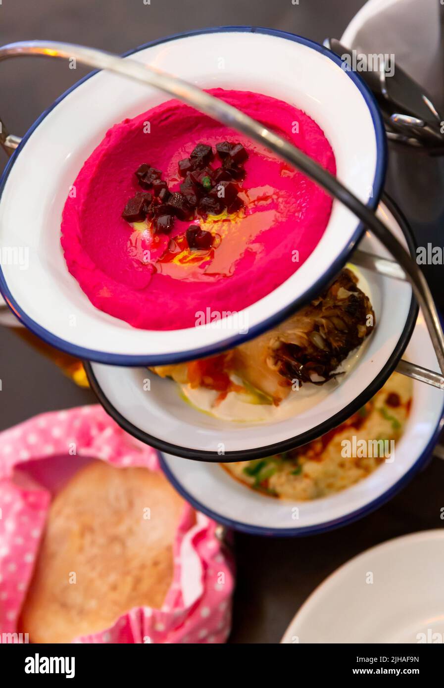 Three meze dishes served on rack Stock Photo