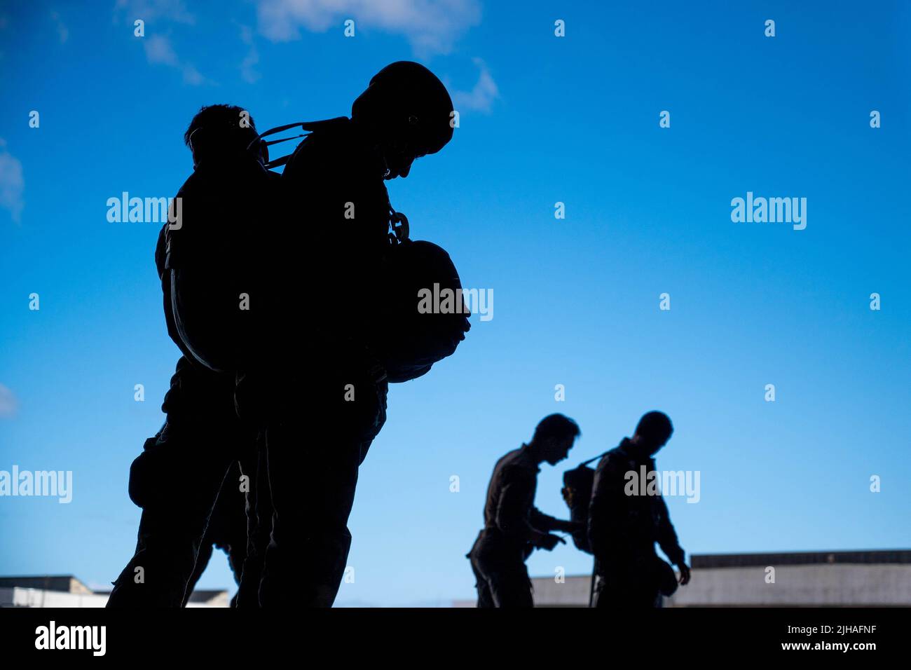 June 24, 2022 - Morocco - U.S. Air Force Airmen from the 435th Contingency Response Squadron and 435th Security Forces Squadron help Moroccan Armed Forces service members before an airborne operation during Exercise AFRICAN LION 22 on June 24, 2022, in Morocco. More than 7,500 participants from 28 nations and NATO train together with a focus on enhancing readiness for U.S. and partner-nation forces. AL22 is a joint all-domain, multi-component, and multinational exercise, employing a full array of mission capabilities with the goal to strengthen interoperability among participants and set the t Stock Photo