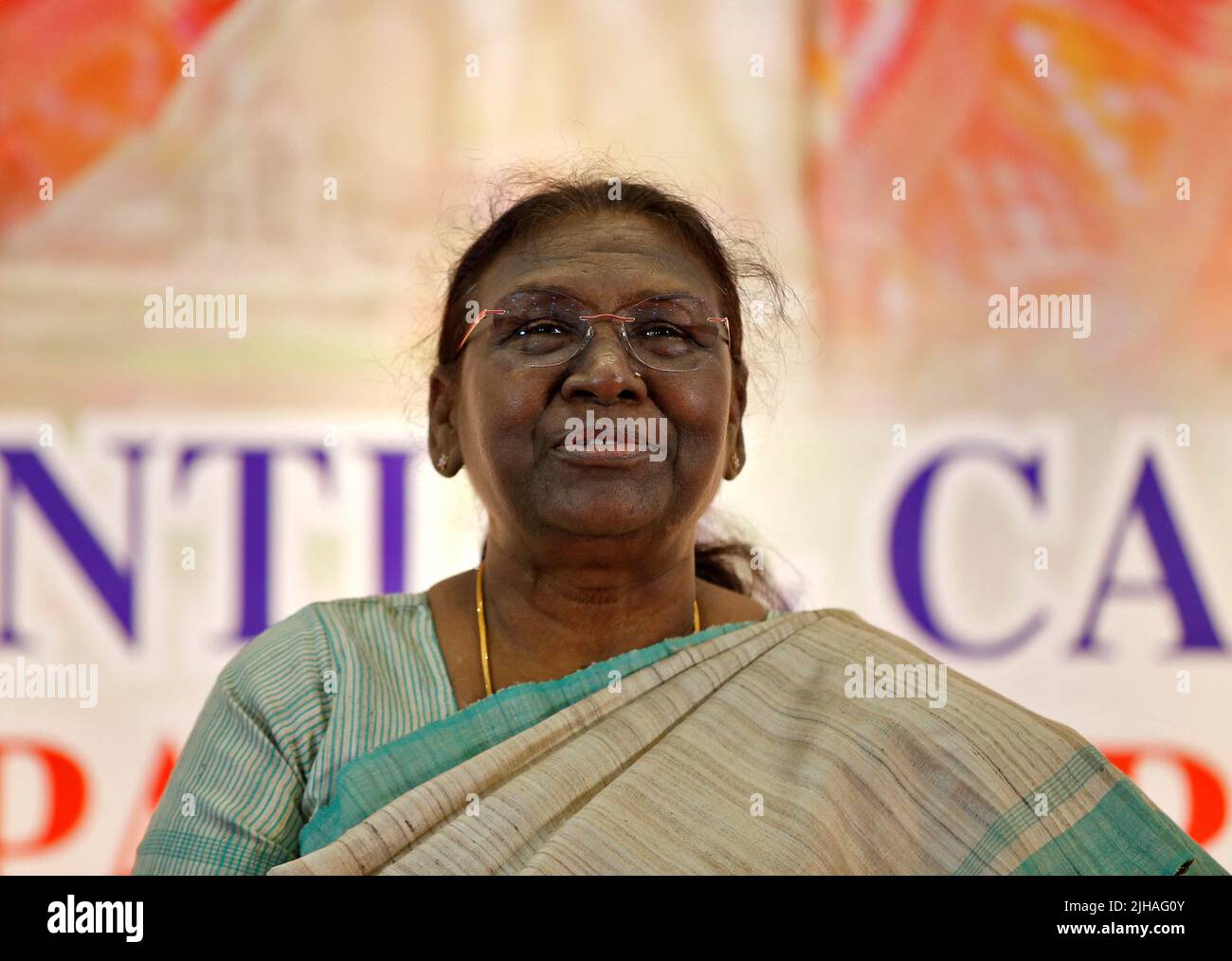 Droupadi Murmu, 64, a female politician who was nominated as presidential candidate by Prime Minister Narendra Modi's ruling Bharatiya Janata Party (BJP), attends a meeting ahead of India's presidential elections, in Ahmedabad, India, July 17, 2022. REUTERS/Amit Dave Stock Photo