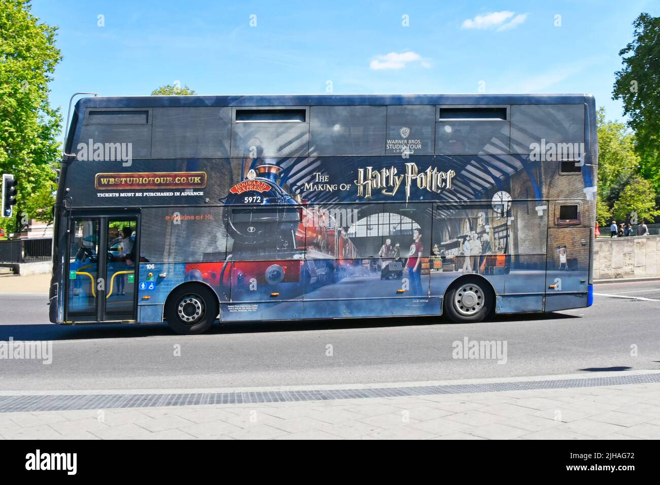 Shuttle tour bus running passenger route for enthusiasts from Victoria to Warner Bros ‘Harry Potter Studio Tour’ experience at Watford England UK Stock Photo