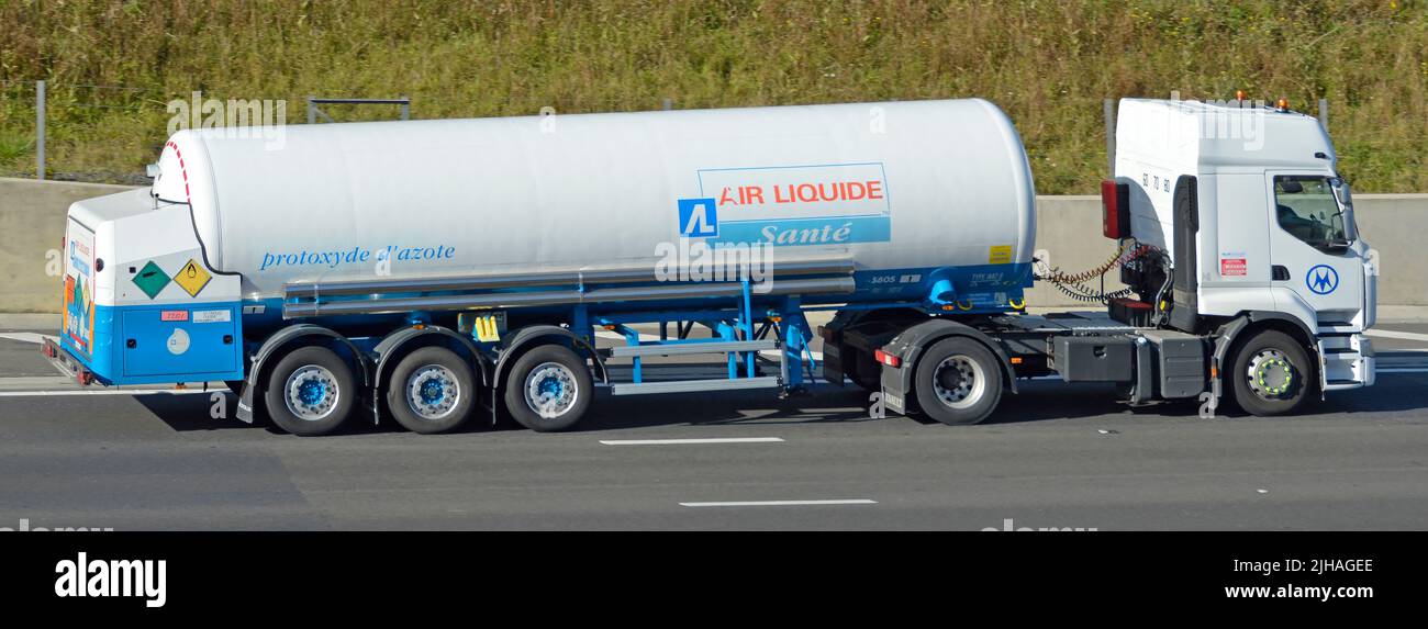 Air Liquide side view brand logo & safety icons articulated trailer of French multinational business supplies industrial gases lorry truck UK motorway Stock Photo