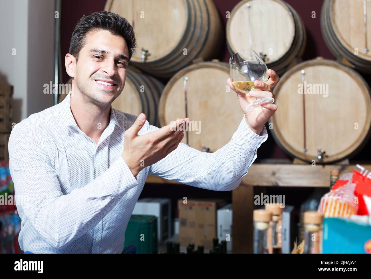 Man tasting wine in store Stock Photo
