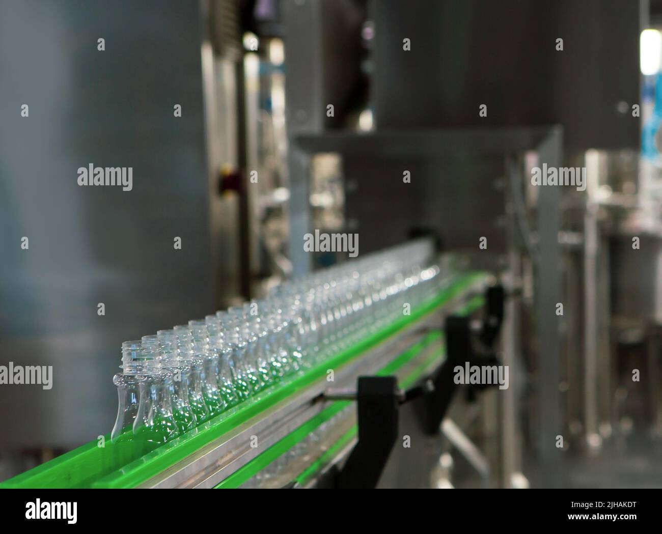 Process of water bottling plant. Plastic bottle on conveyor belt in