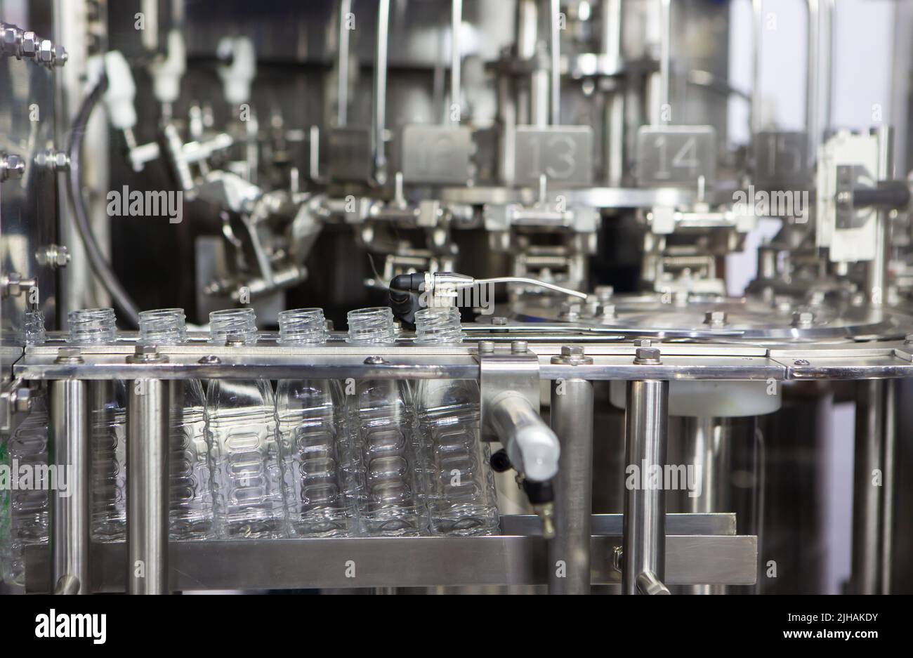 Process of water bottling plant. Plastic bottle on conveyor belt in