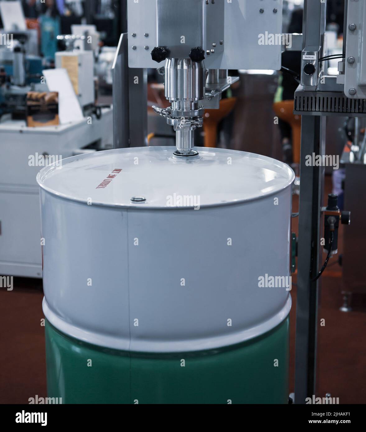 Automatic drum filling machine. Liquid barrel filler Stock Photo Alamy