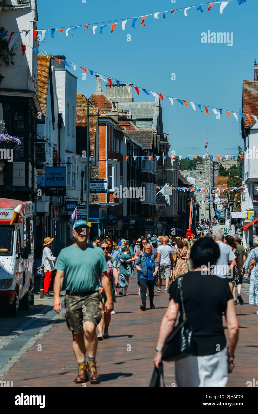 View of pedestrians on The High Street in the historic city centre, Canterbury, Kent Stock Photo