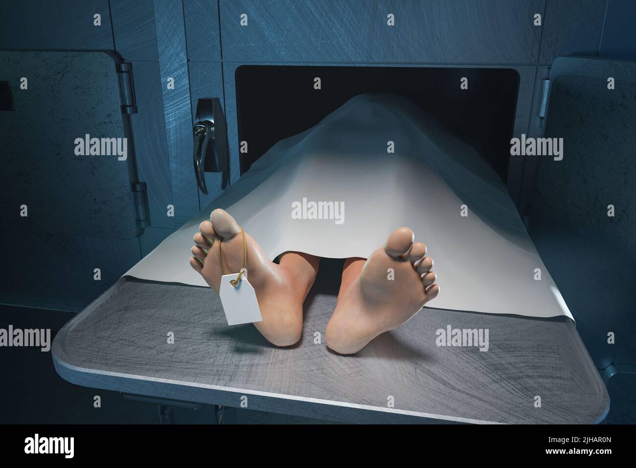 The feet of a deceased person stick out from under the sheet in the hospital morgue Stock Photo