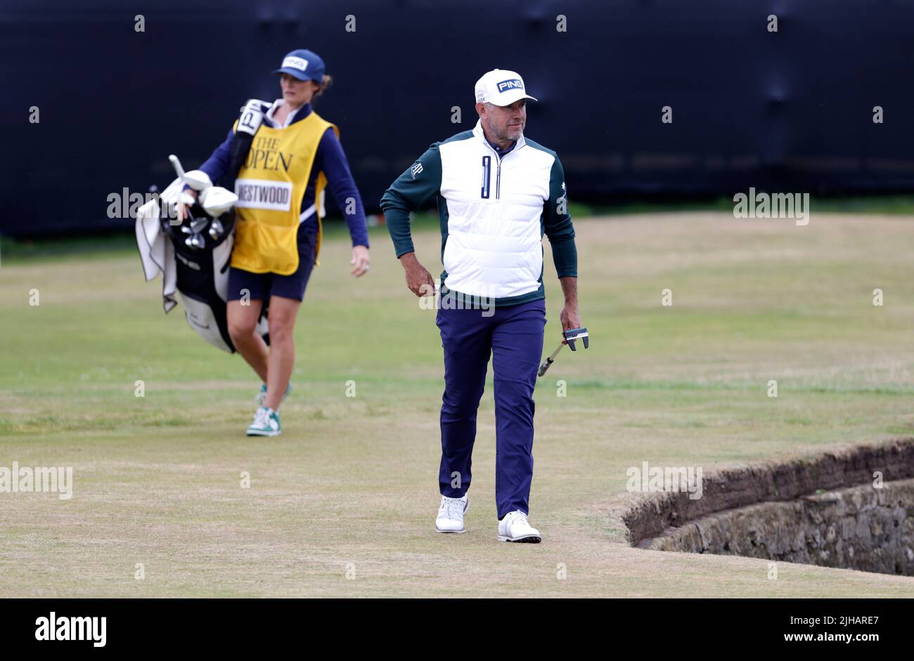 England's Lee Westwood with caddie and wife Helen Storey during day