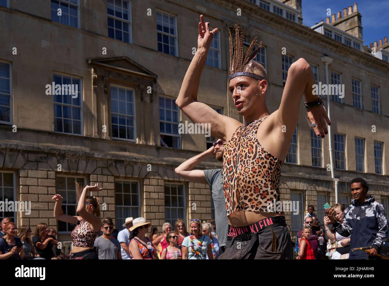 Dancers in ornate costumes performing at the annual carnival as it progresses through the streets of the historic city of Bath in Somerset. Stock Photo