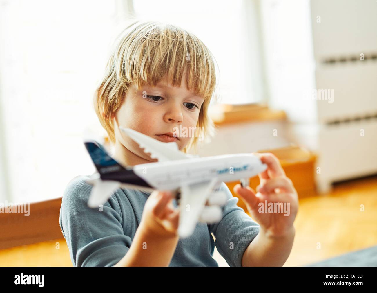 child toy boy fun kid childhood playing toy airplane travel vacation plane holiday fly flight summer journey trip happy Stock Photo