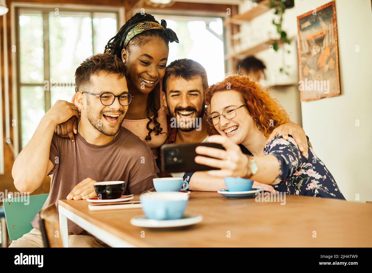 woman friendship fun friend cafe smiling lifestyle happy selfie camera photo people cheerful laughing coffee Stock Photo
