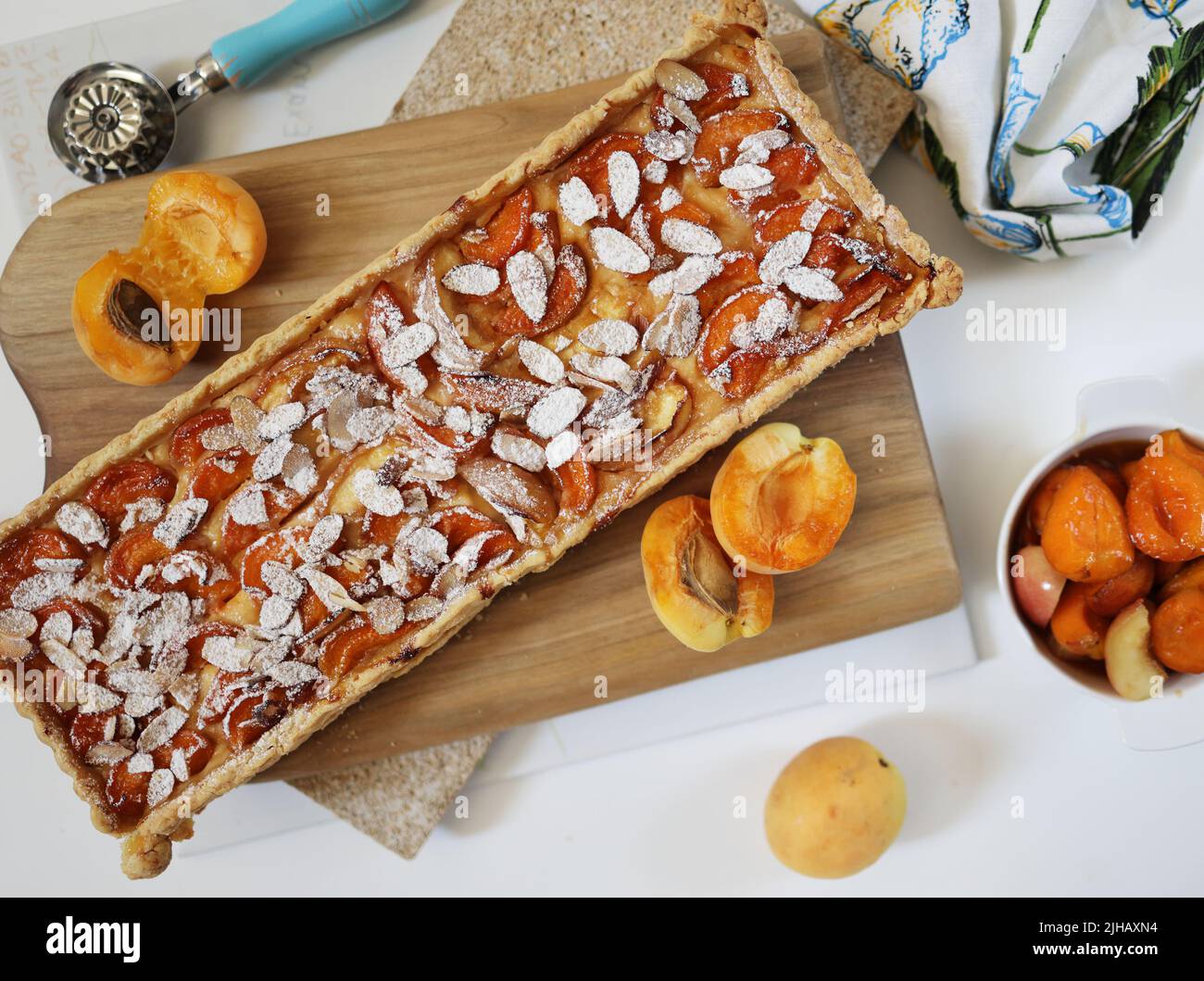 Homemade rectangular shortbread pie with apricots and peaches. White ...