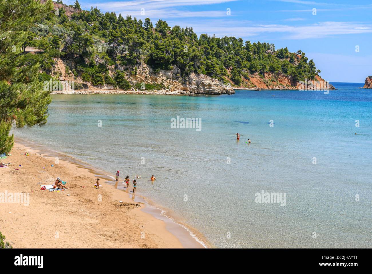 Beautiful Summer Scenery With A Lot Of Swimmers At Chrisi Milia Beach Beautiful Summer Scenery With A Lot Of Swimmers At Chrisi Milia Beach