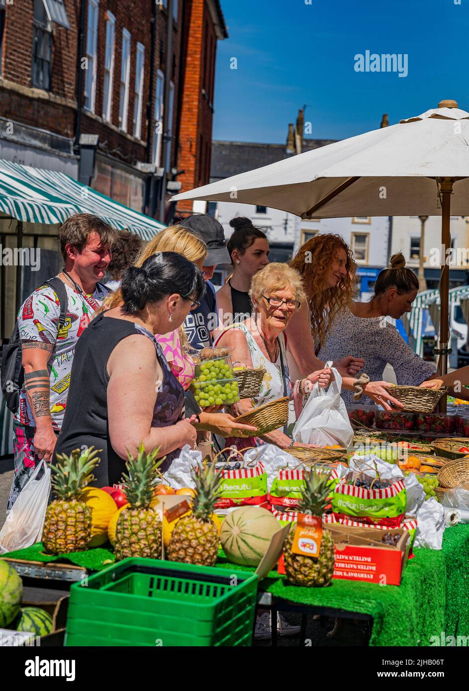 Grantham, Lincolnshire, UK Shoppers at the traditional street market