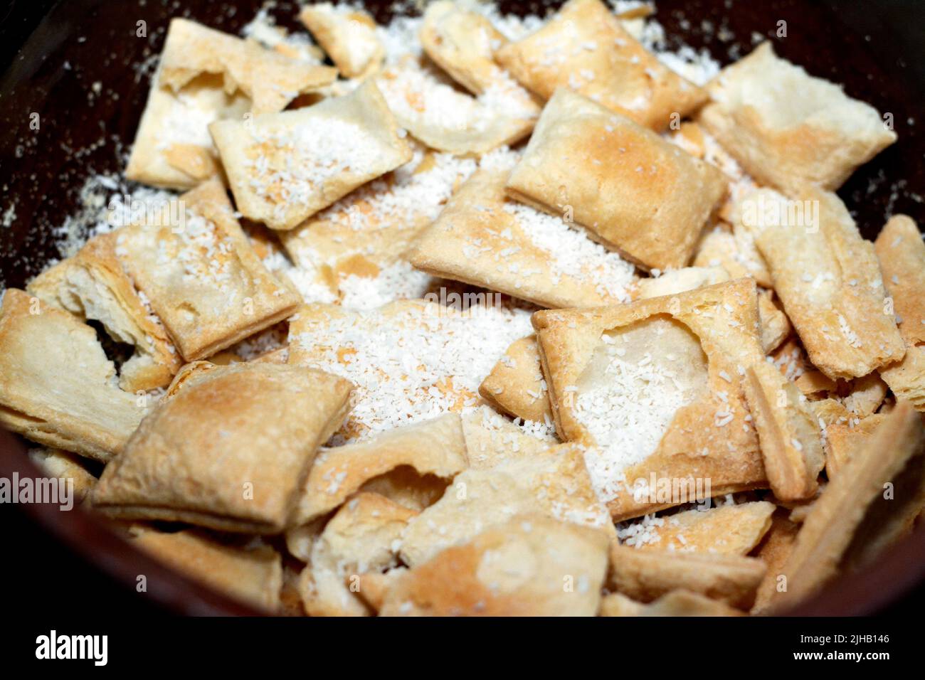 Egyptian Bread Pudding in a brown bowl pottery casserole made of milk