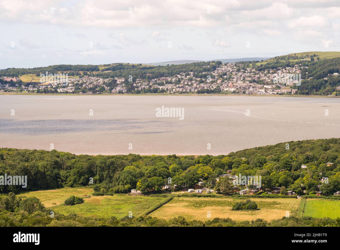 A view of Grange Over Sands across the river Kent estuary from above Arnside, in Cumbria, England, UK Stock Photo