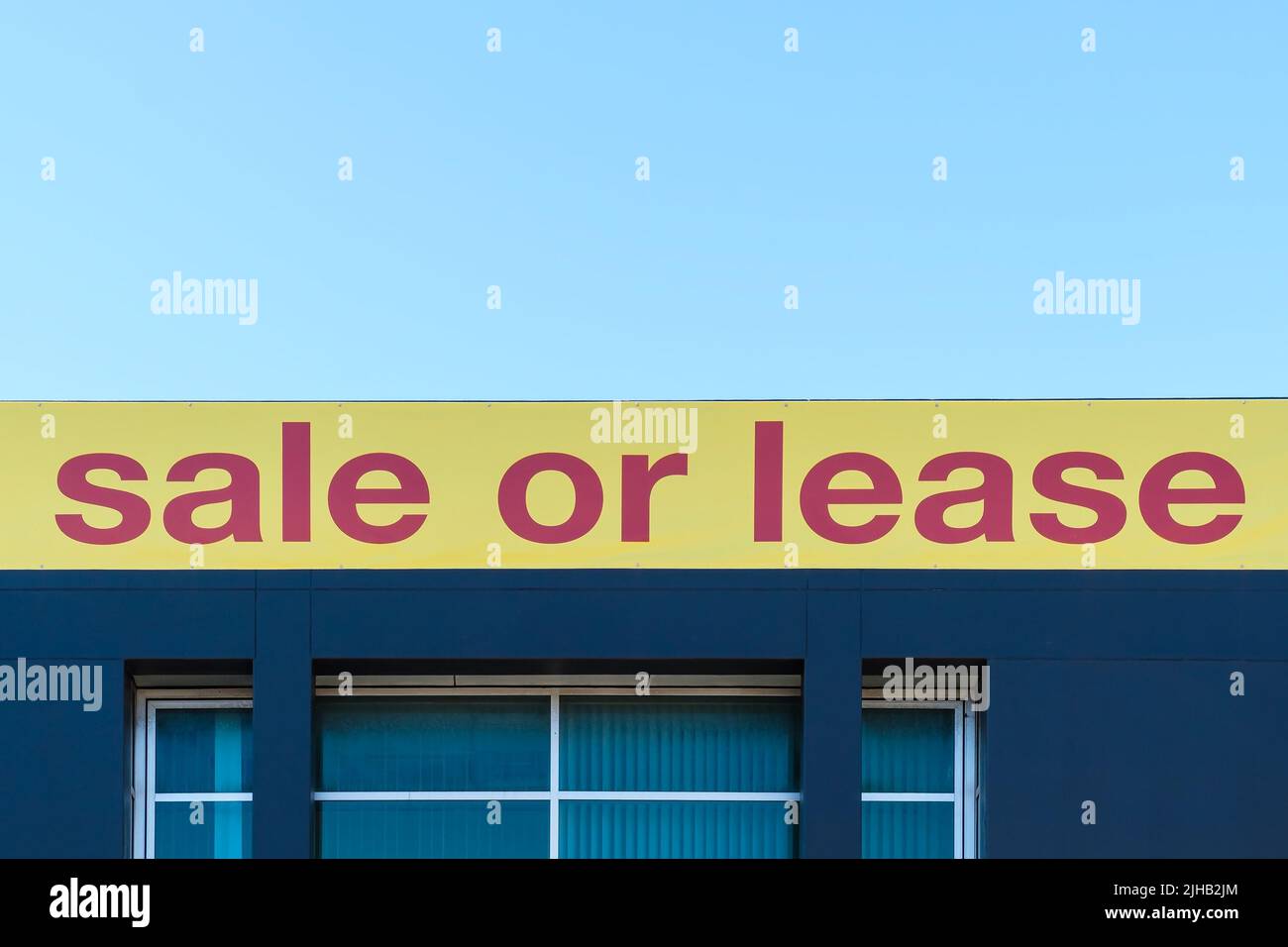 Property for sale banner displayed on the building facade in South Australia Stock Photo
