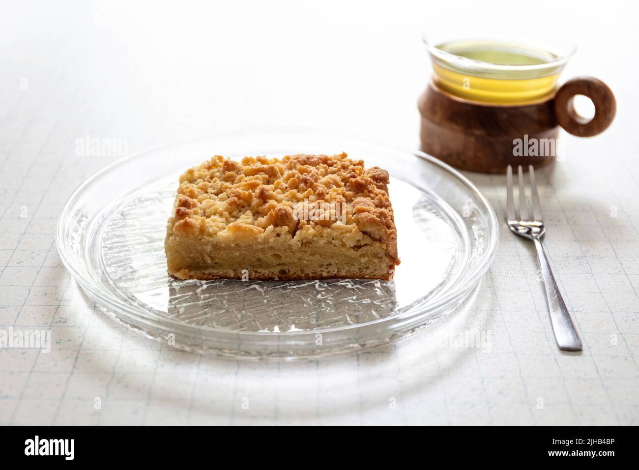 traditional German Streuselkuchen (crumb cake) on glass plate Stock Photo