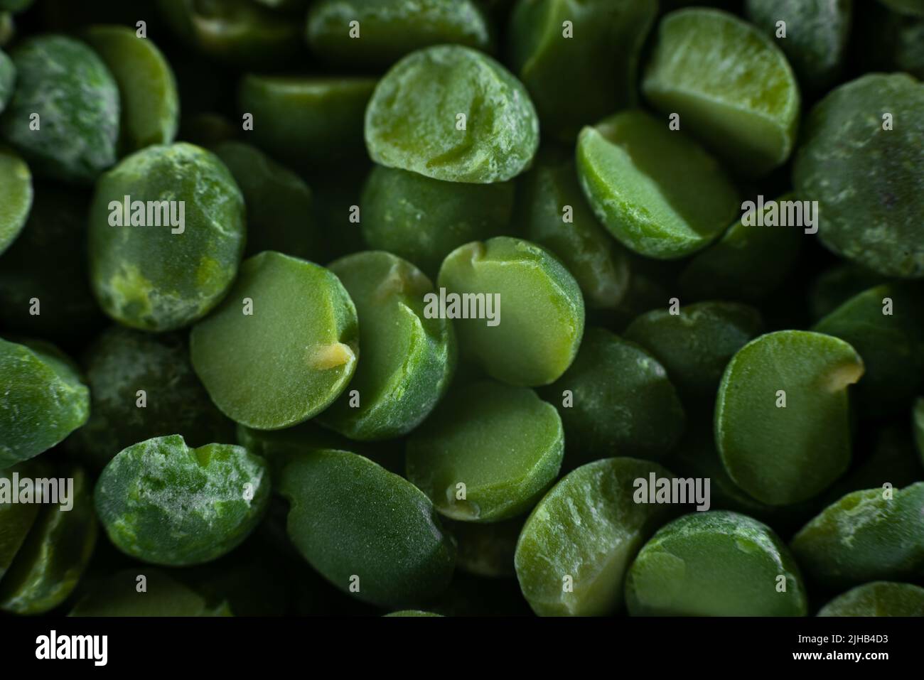 Extreme closeup. Ground chopped green peas. Green Peas. Green background. Peas background. Top view Stock Photo