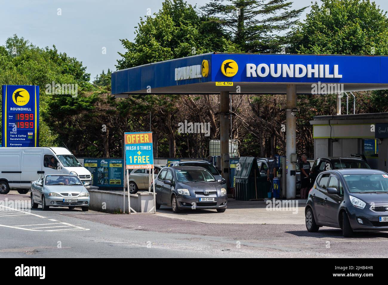 Bandon, West Cork, Ireland. 17th July, 2022. Diesel and petrol have dropped below €2 per litre for the first time in months at the Roundhill Garage, Bandon. Big queues of cars were present this afternoon as drivers rushed to get the lower priced fuel. Credit: AG News/Alamy Live News Stock Photo