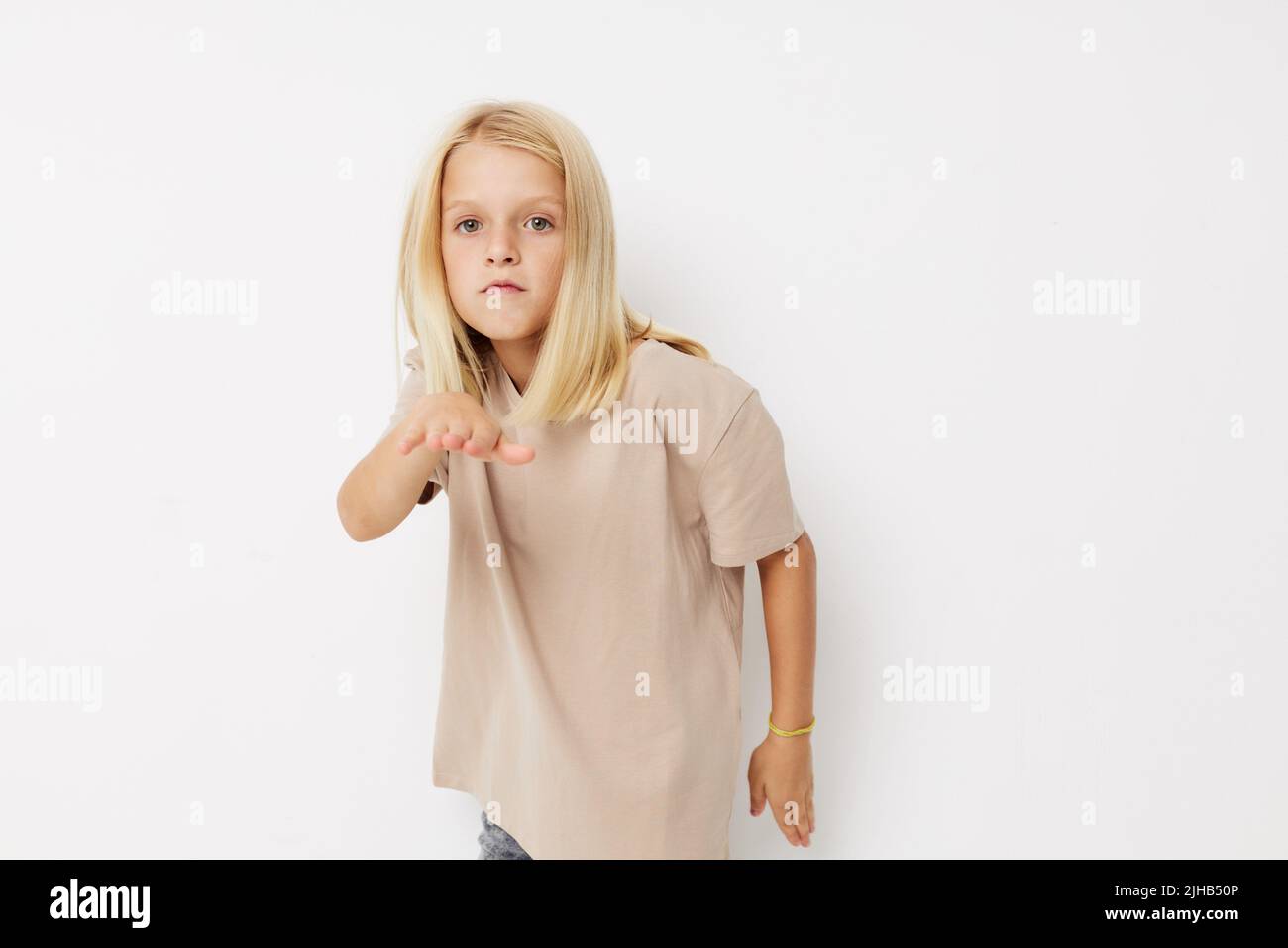 Positive little girl fashionable baby clothes kids lifestyle concept