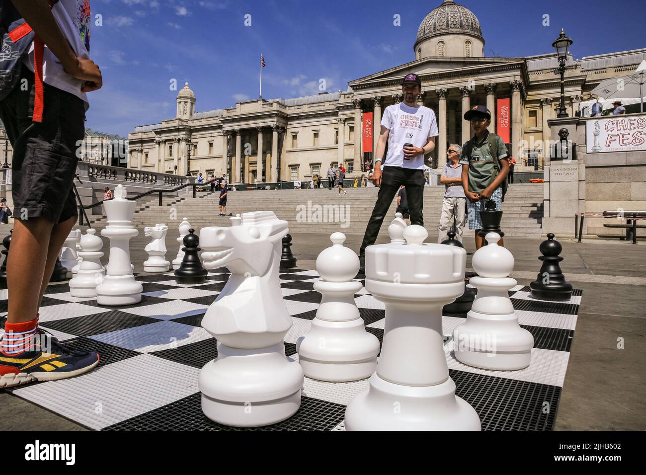 London, UK. 17th July, 2022. Players of all ages and capabilities play chess on the square. The UK's largest one-day chess event takes place on London's Trafalgar Square and is aimed at anyone who loves or wants to learn chess, and is free of charge. Credit: Imageplotter/Alamy Live News Stock Photo