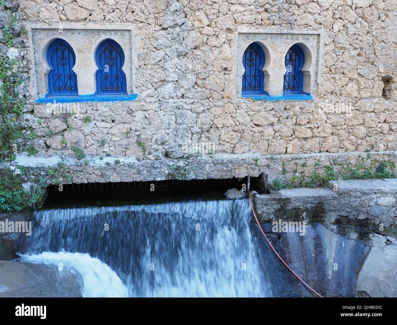 Islamic building and Ras El Maa waterfall in african Chefchaouen town ...