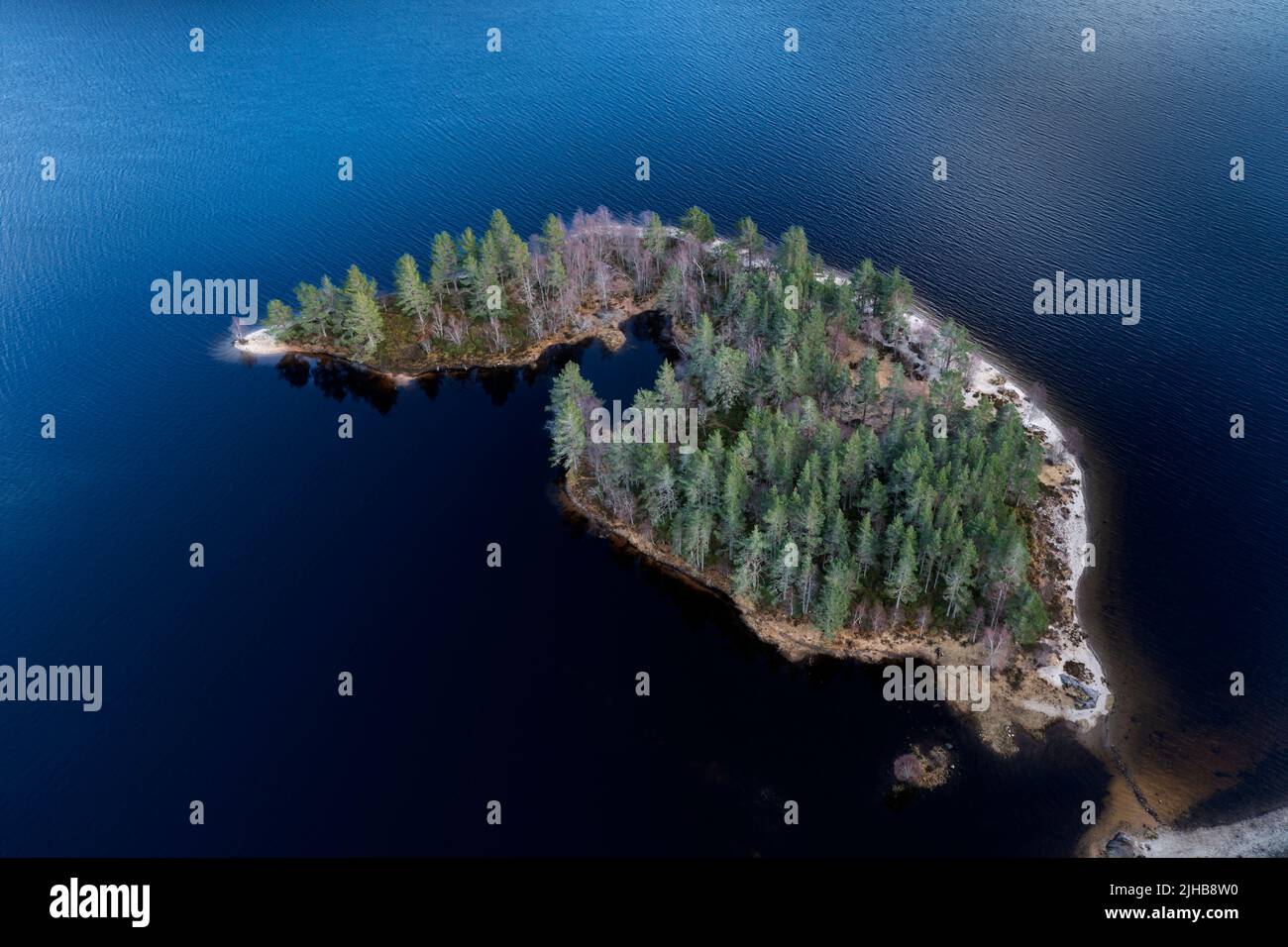Island in Loch Beinn a' Mheadhoinm,  Glen Affric near Cannich, Highlands Scotland. Drone shot Stock Photo