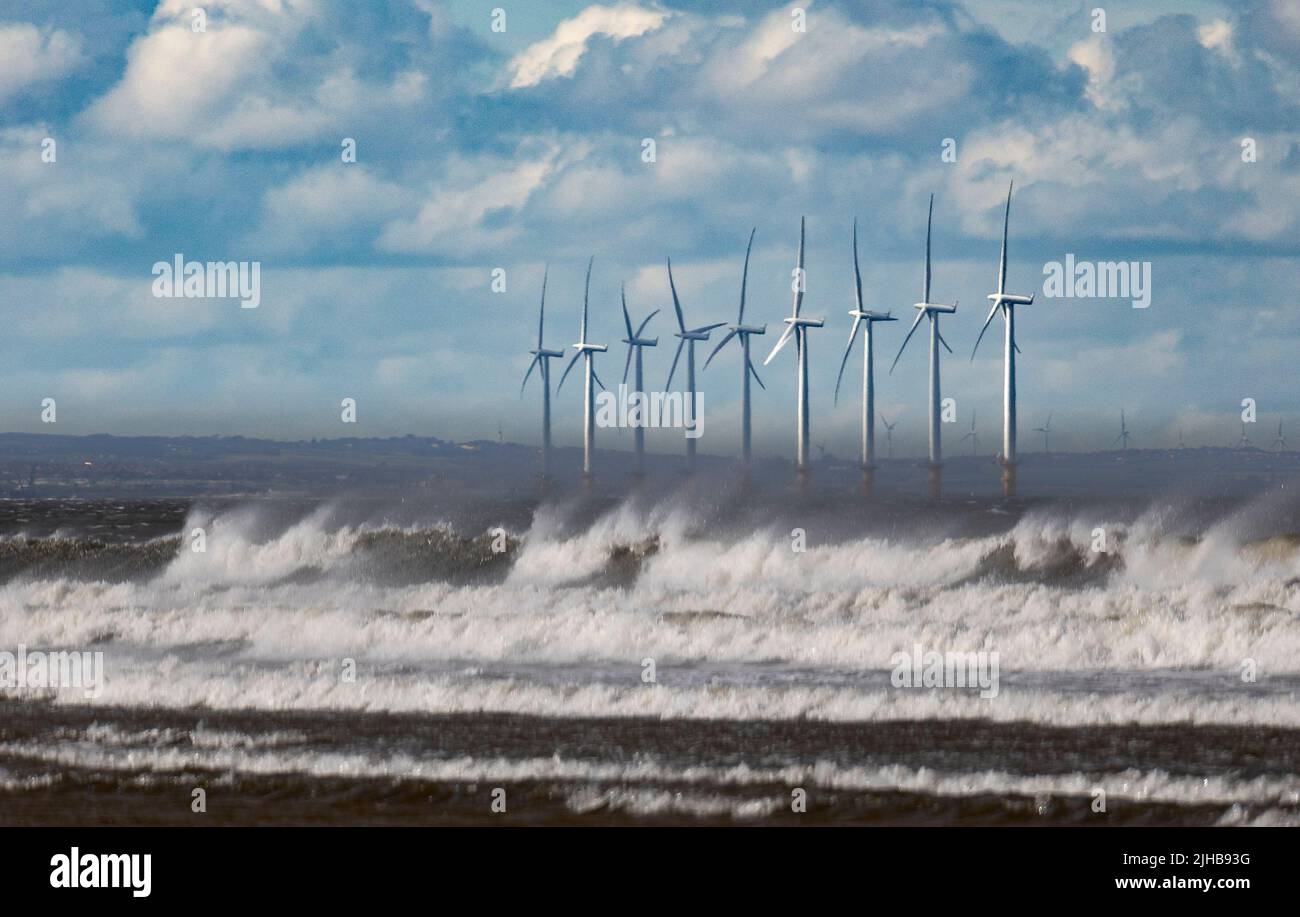 Waves and Wind Turbines off the River Tees M outh, Redcar, Cleveland, Yorkshire Stock Photo