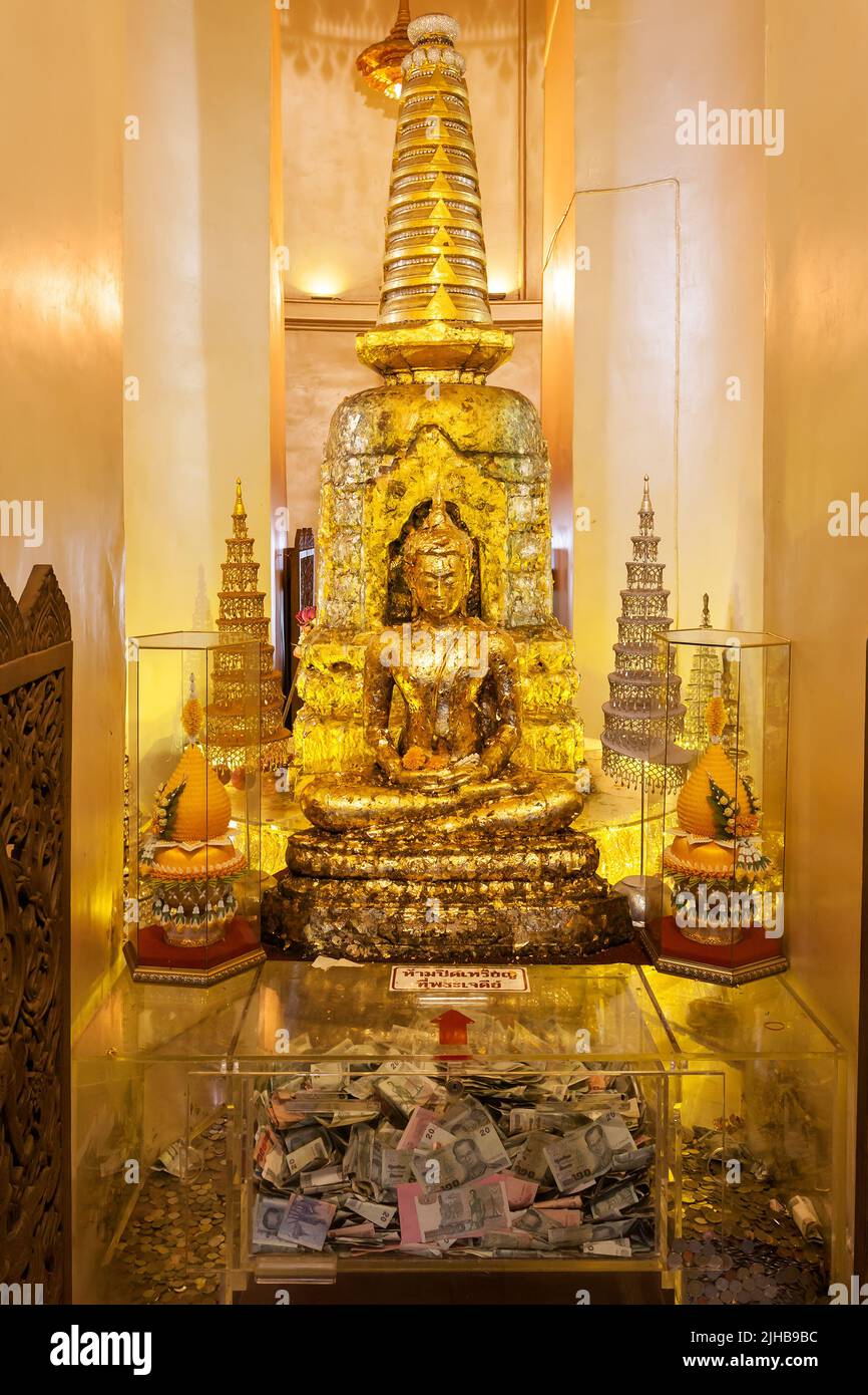 Bangkok, Thailand - December 12, 2012: Golden Buddha in buddhist monastery in Bangkok Stock Photo