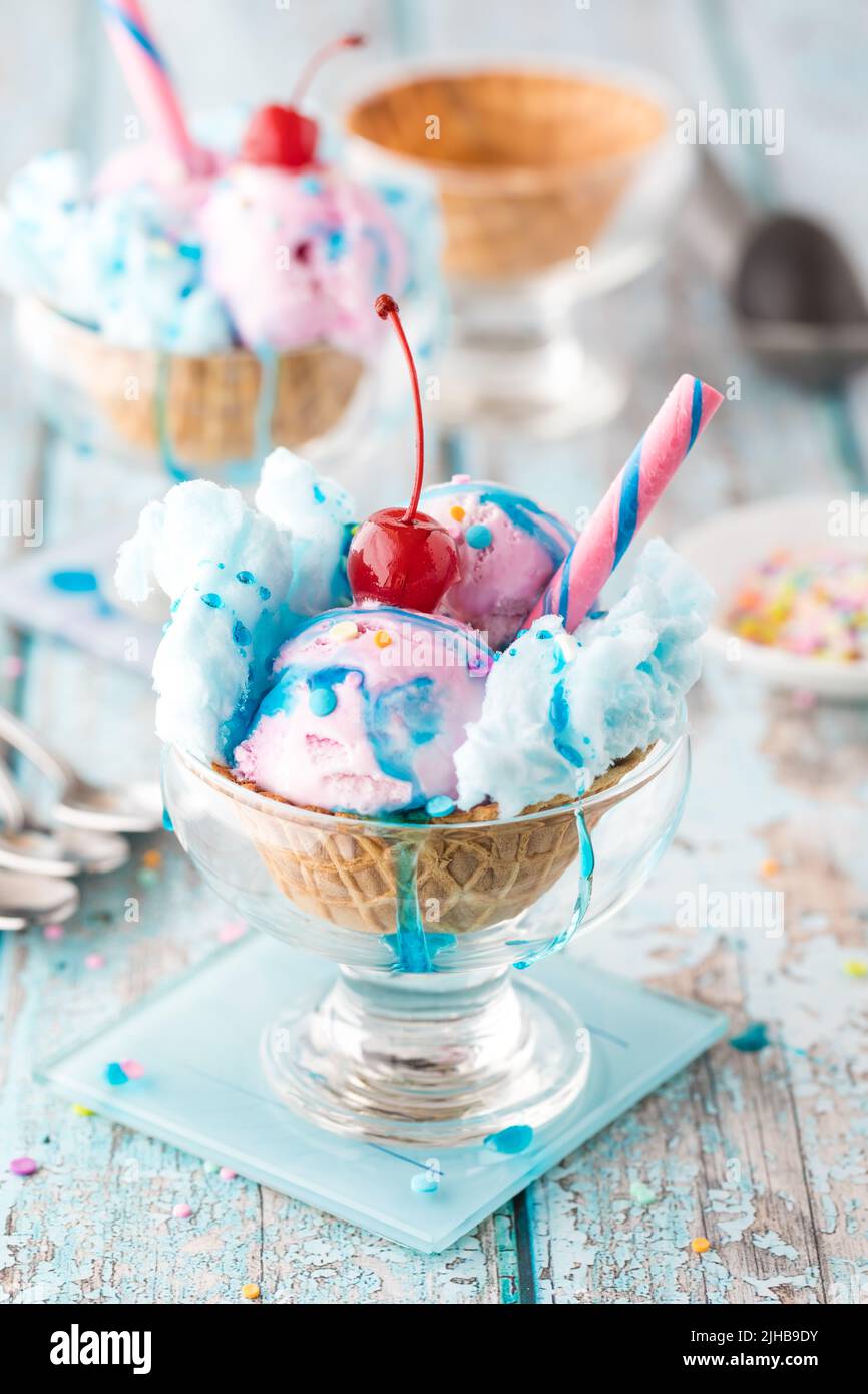Cotton candy ice cream sundaes dripping in sticky cotton candy syrup