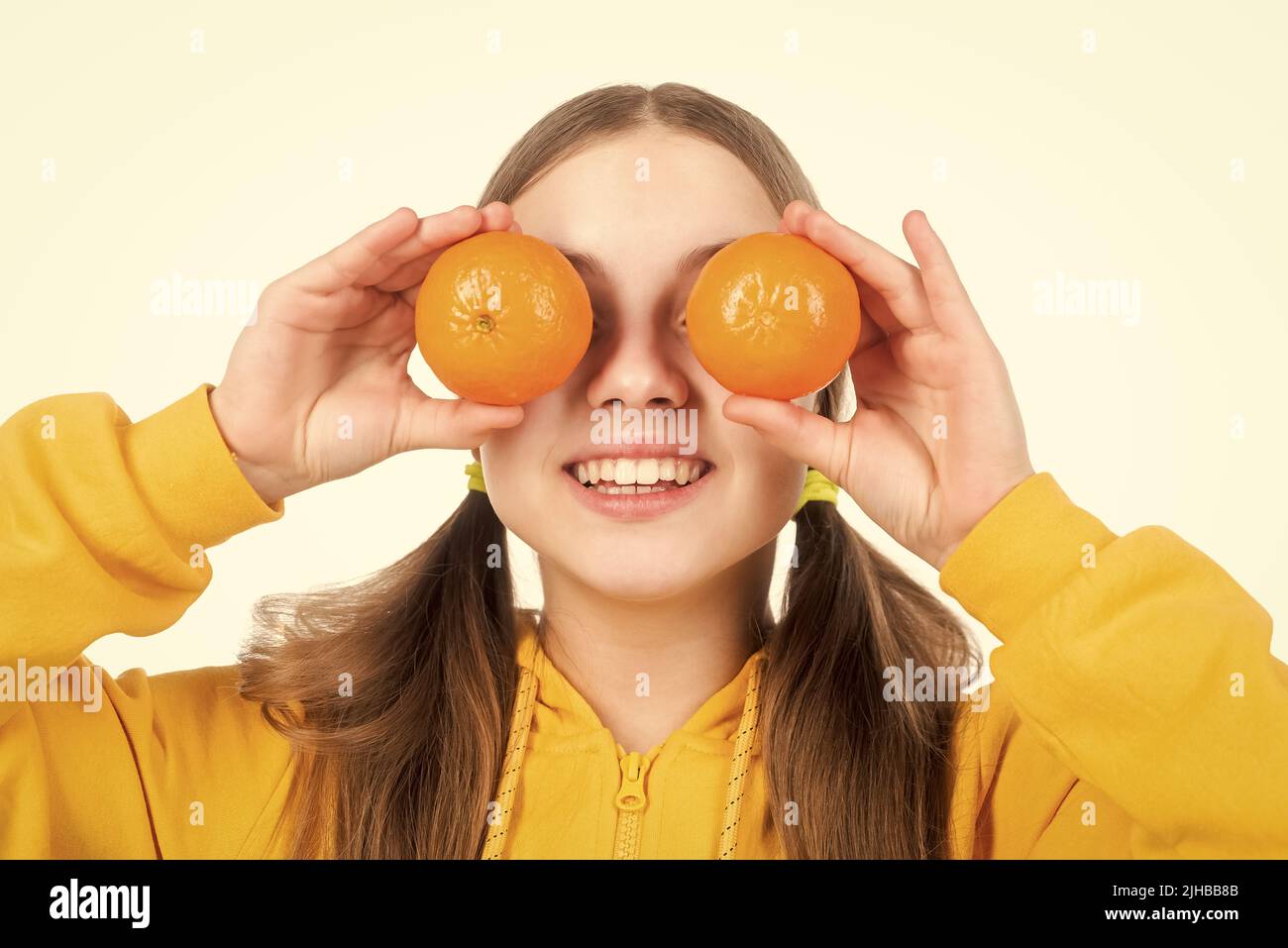 happy kid hold citrus lemon fruit with vitamins isolated on white