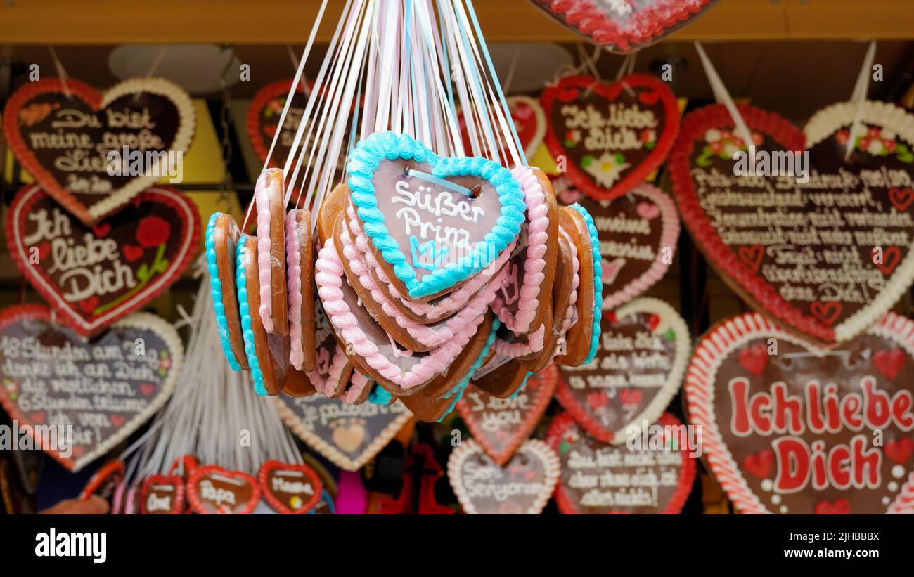 Candy booth with traditional German gingerbread hearts at the popular fun fair 'Rheinkirmes' 2022 in Düsseldorf/Germany. Stock Photo