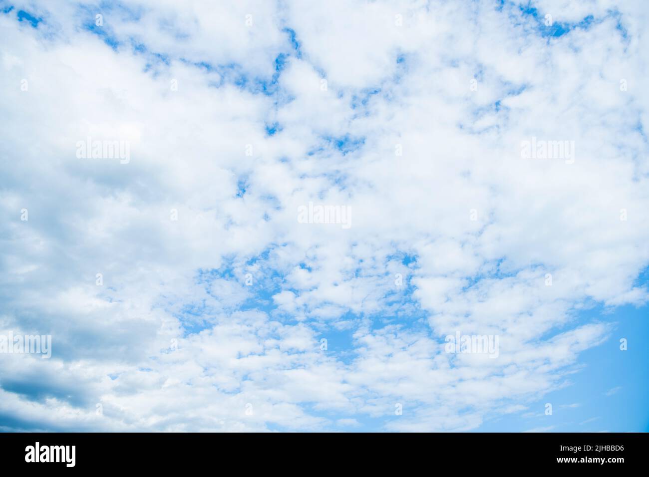 blue sky background with white fluffy clouds Stock Photo - Alamy
