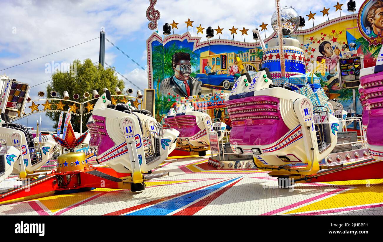 Colourful 'Shake & Roll' funfair ride at the popular fun fair 'Rheinkirmes' 2022 in Düsseldorf/Germany, the biggest fun fair on the Rhine. Stock Photo