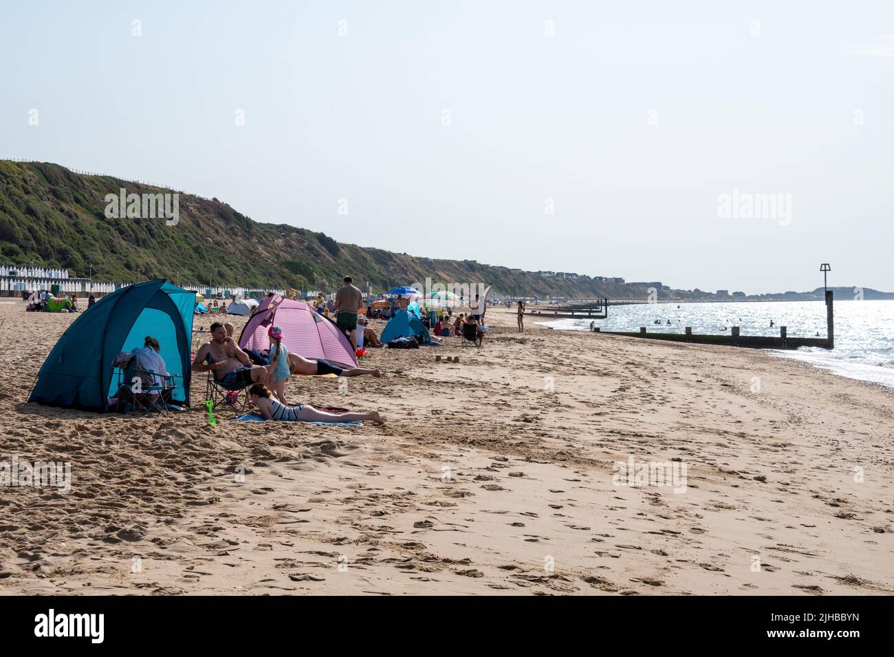 Boscombe Beach, Bournemouth, Dorset, England, UK, 17th July 2022, Weather. Record breaking heatwave moves in across the south coast and an amber warning is in place from the Met Office for heat. The beach is quickly filling with people mid-morning. Credit: Paul Biggins/Alamy Live News Stock Photo