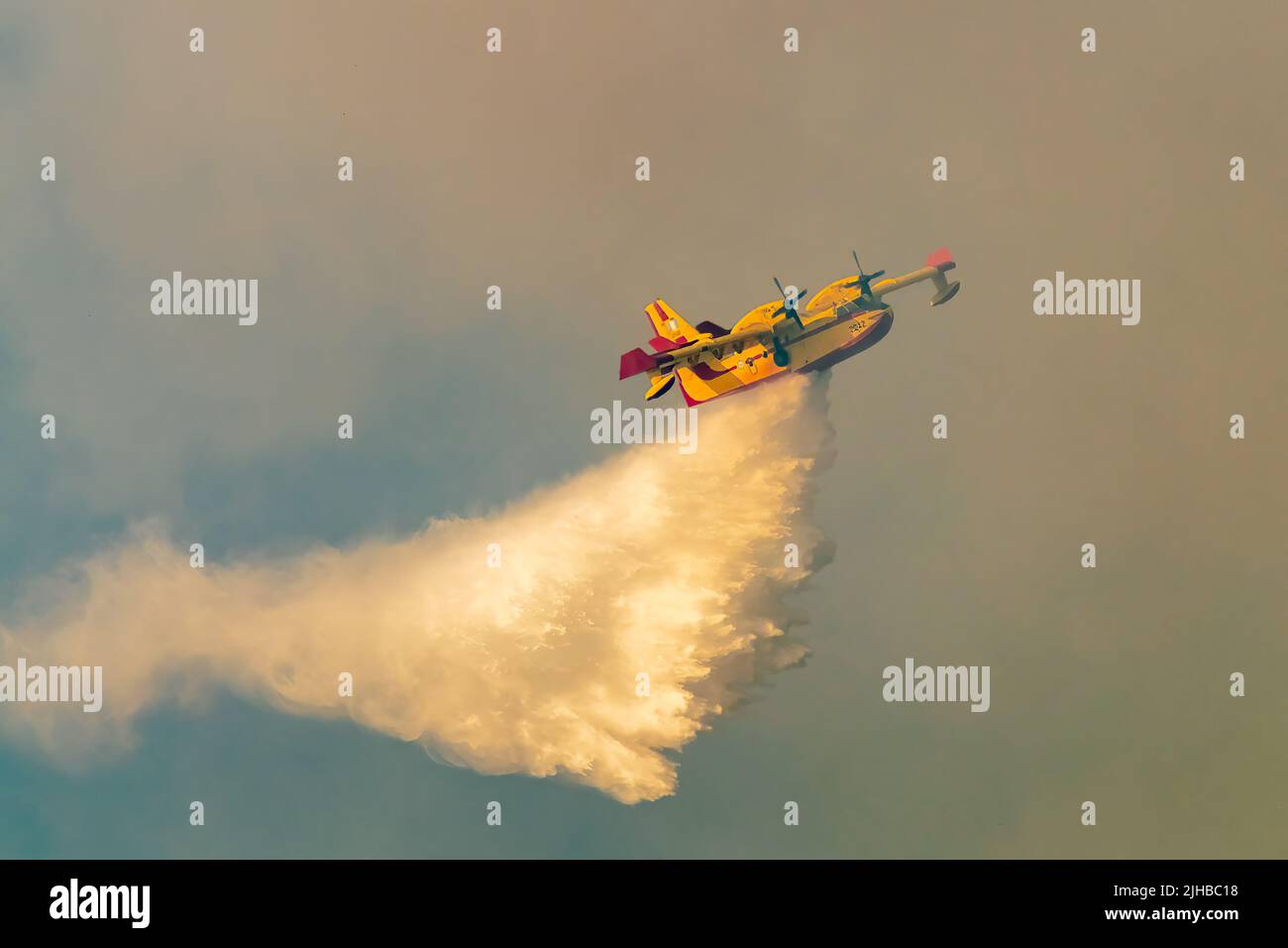Loutraki, Greece 14 September 2019. Fire plane spraying water at Geraneia mountain to eliminate the fire. Stock Photo
