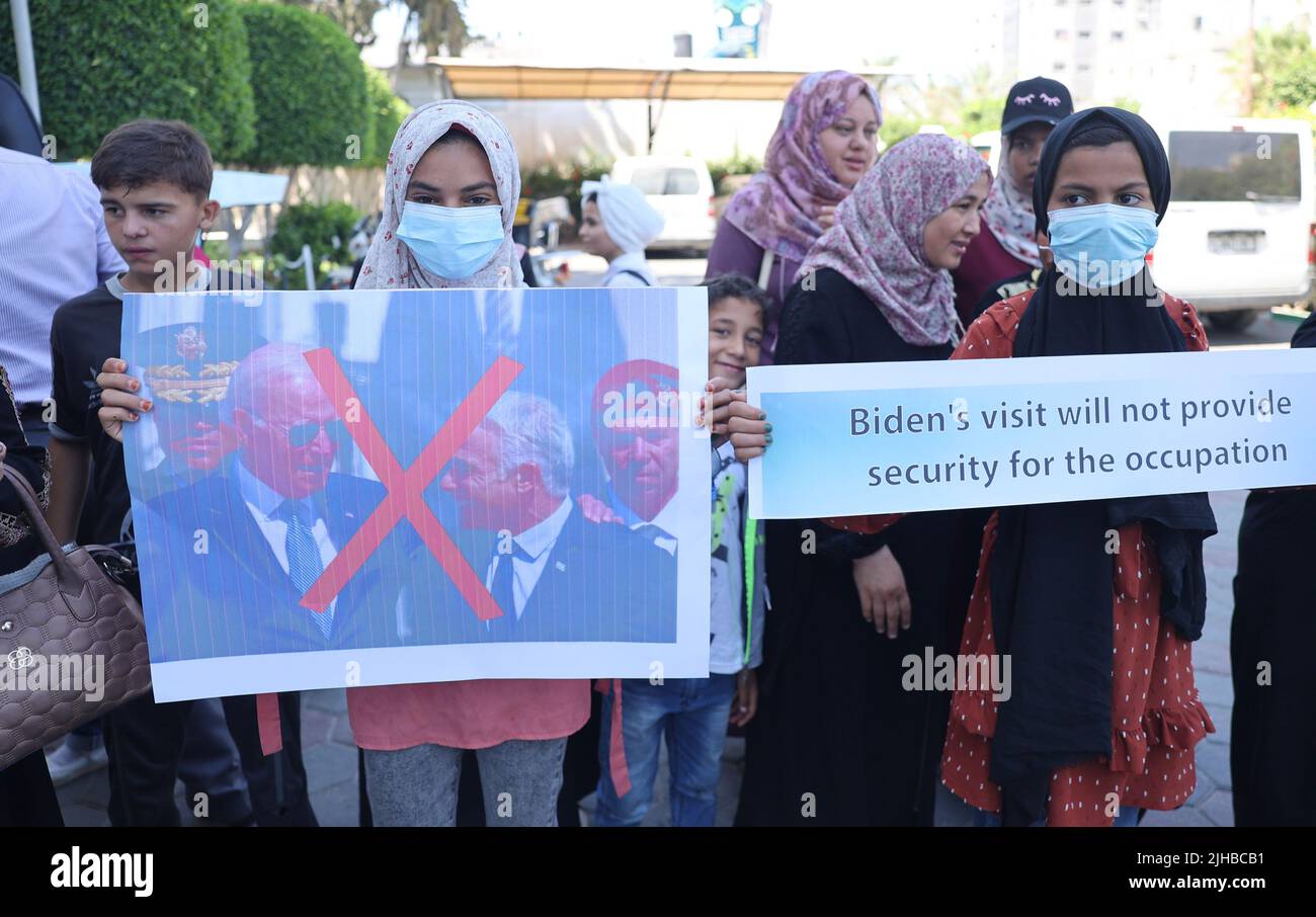 Palestinians carrying portraits of the US President Joe Biden Attend a Rally Against The Recent Visit of The US President to Israel in Khan Yunis in the southern Gaza Strip, on Sunday on July 17, 2022. Photo by Ismael Mohamad/UPI Credit: UPI/Alamy Live News Stock Photo