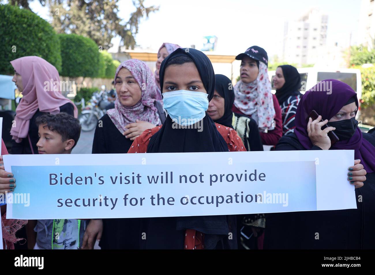 Palestinians women carrying placards Attend a Rally Against The Recent Visit of The US President to Israel in Khan Yunis in the southern Gaza Strip, on Sunday on July 17, 2022. Photo by Ismael Mohamad/UPI Credit: UPI/Alamy Live News Stock Photo