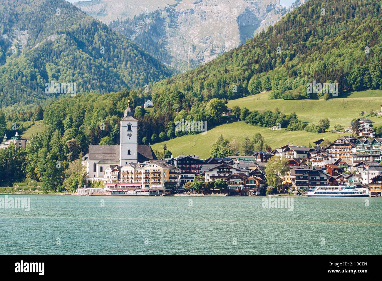 St. Wolfgang at the famous lake Wolfgangsee in Salzkammergut, Austria. View from the lake to the touristic travel destination. Stock Photo