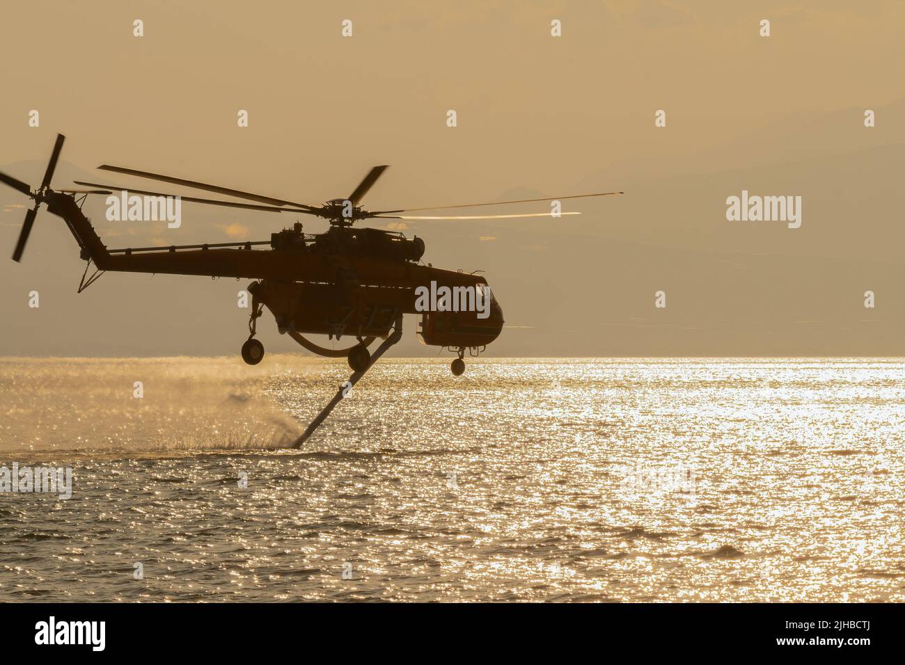 Loutraki, Greece 14 September 2019. Fire helicopter at Loutraki in Greece for the big fire gathering water. Close up view. Stock Photo