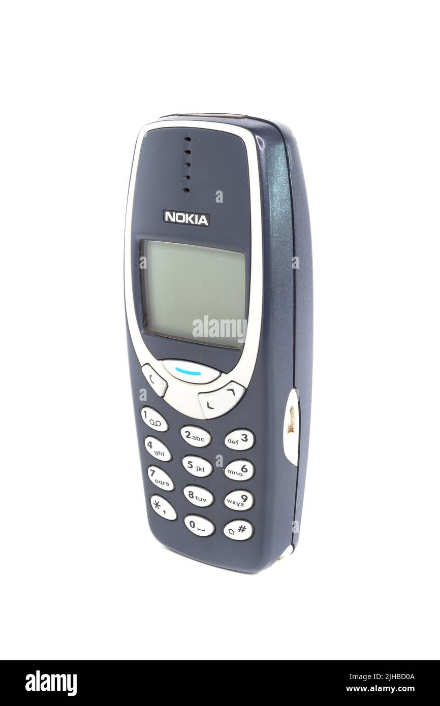 Vintage mobile phone Nokia 3310 on a white background. Isolated. Bergamo, ITALY - March 24, 2021. Stock Photo