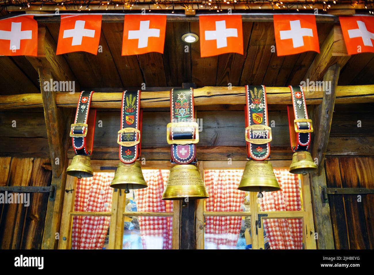 Traditional Swiss Cowbells with flag of Zwitzerland Stock Photo Alamy