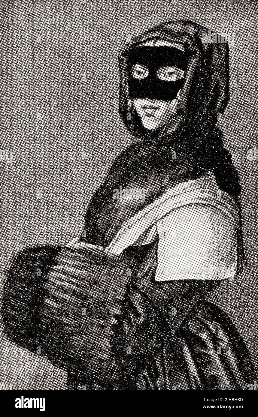 An Englishwoman in winter costume, 17th century.  From Modes and Manners, published 1935. Stock Photo