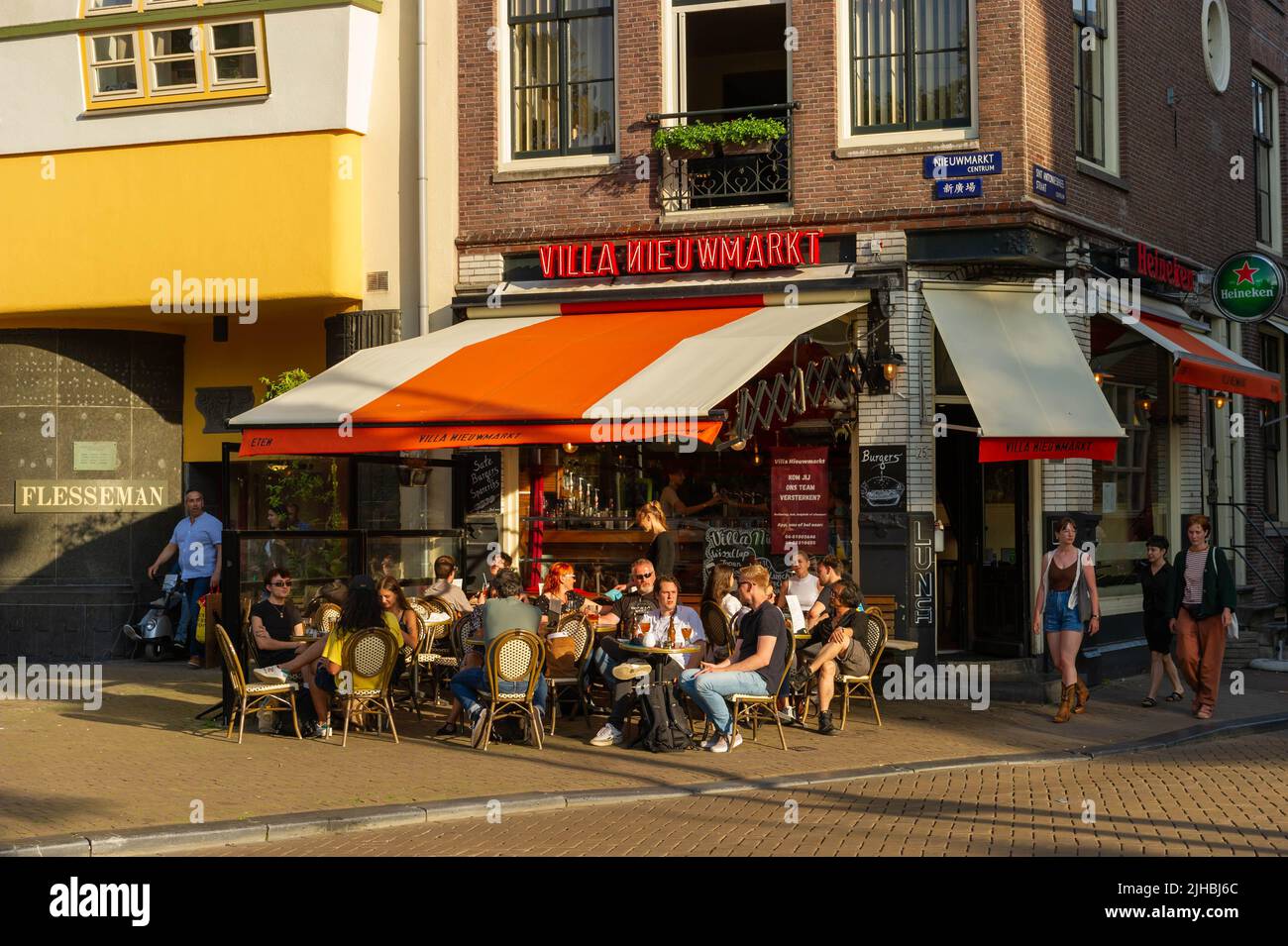 Dining at sunset on the Niewmarkt, Amsterdam, The Netherlands Stock Photo