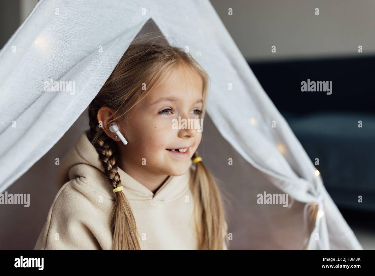 Candid lifestyle portrait of cute little caucasian girl with blonde