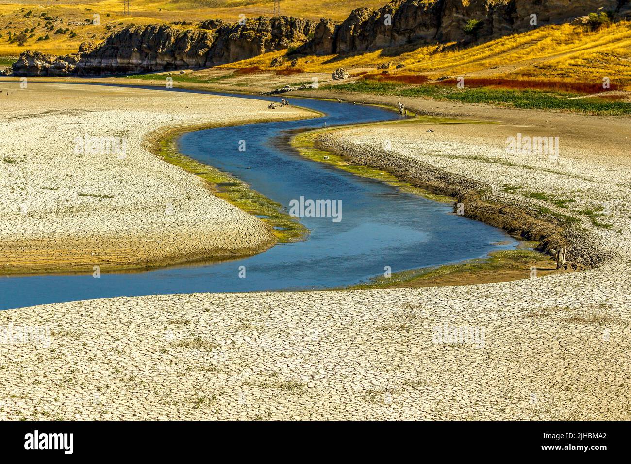 Arid and low-water rivers, dry and cracked soils on their banks Stock ...