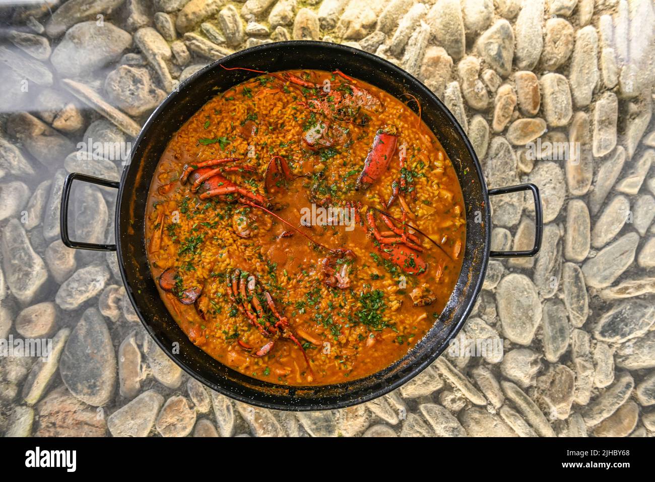 Homemade lobster and seafood paella Stock Photo Alamy